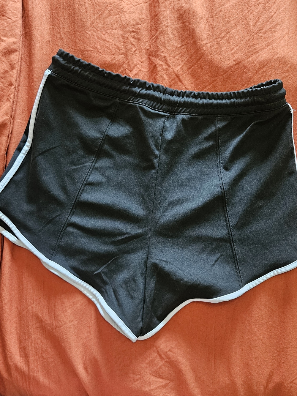 Poof! Black Athletic Shorts with White Trim